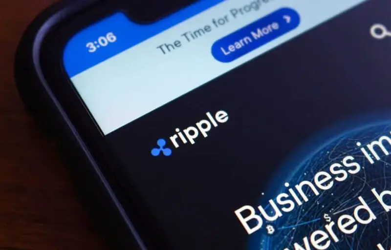 Ripple logo displayed on smartphone with financial interface