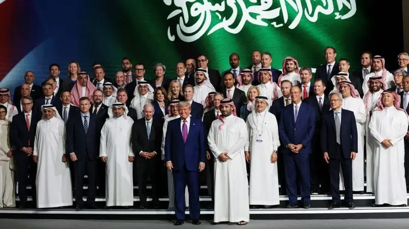 Trump (centre left) and Saudi Crown Prince Mohammed bin Salman (centre right) pose for a photo with business leaders