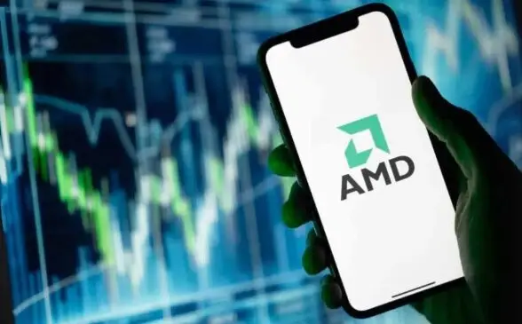 Smartphone displaying AMD logo with stock chart background
