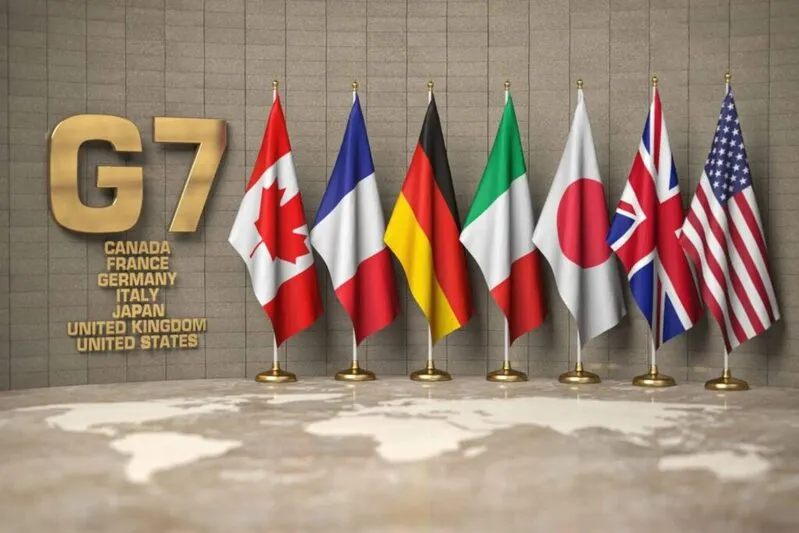 G7 country flags on display with gold G7 logo showing member nations
