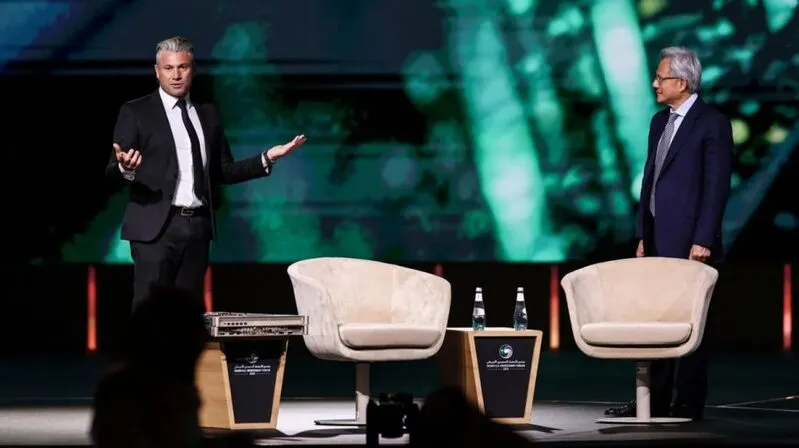 Tareq Amin, CEO of Humain, and Jensen Huang, CEO of NVIDIA, attend the Saudi-U.S. Investment Forum, in Riyadh, Saudi Arabia May 13, 2025.