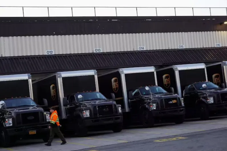 UPS trucks at distribution facility