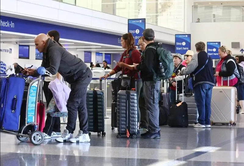 Passengers waiting in airport terminal Alaska Air
