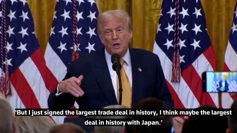 Trump at White House podium announcing Japan deal