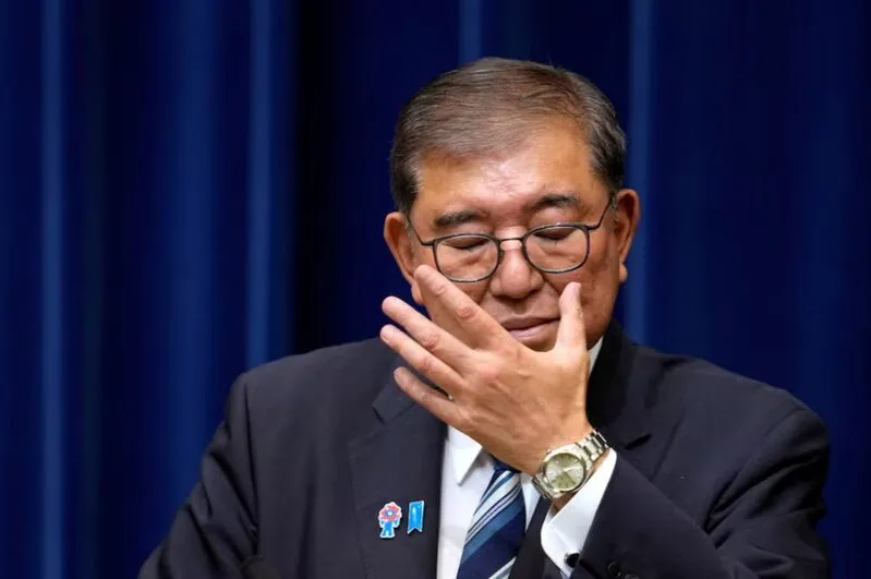 PM Ishiba covering his face during emotional announcement