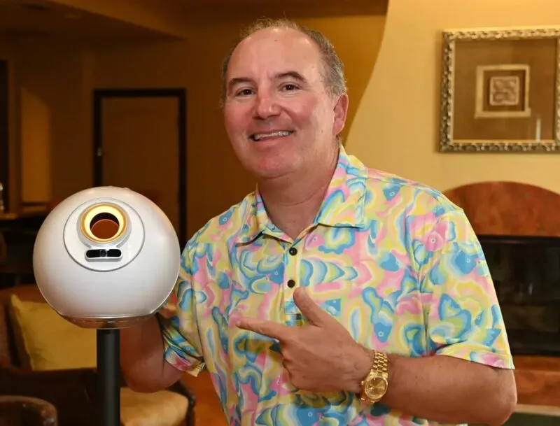 Dan Ives with Worldcoin Orb device