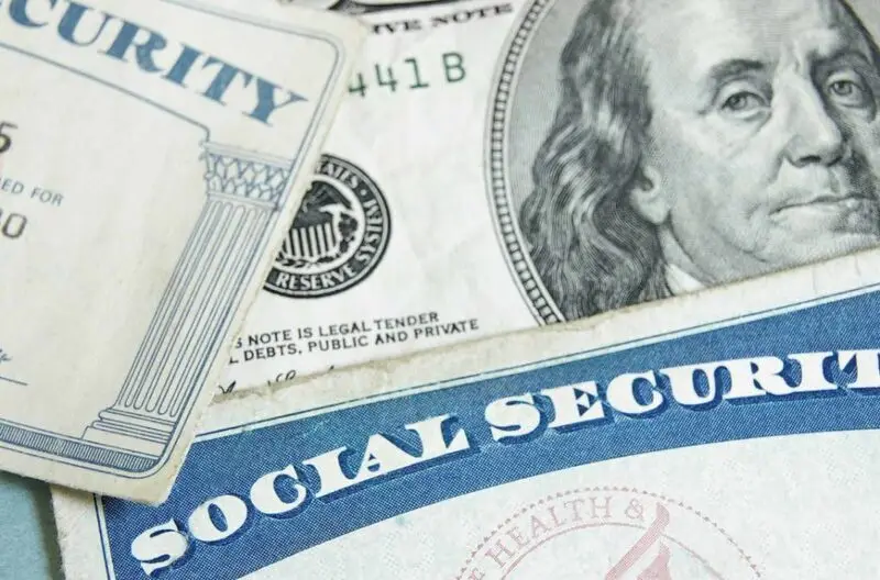 Social Security card with dollar bills and Federal Reserve seal