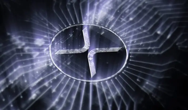 XRP logo illuminated with purple light rays on digital background