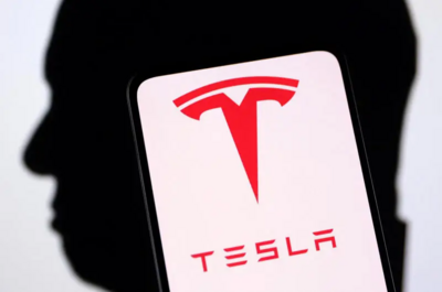 Tesla Stock Plummets 50%—Time to Sell or Hold?